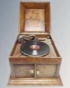 An early 20th century oak cased table top gramophone