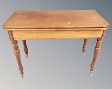 A Victorian mahogany turnover top tea table.