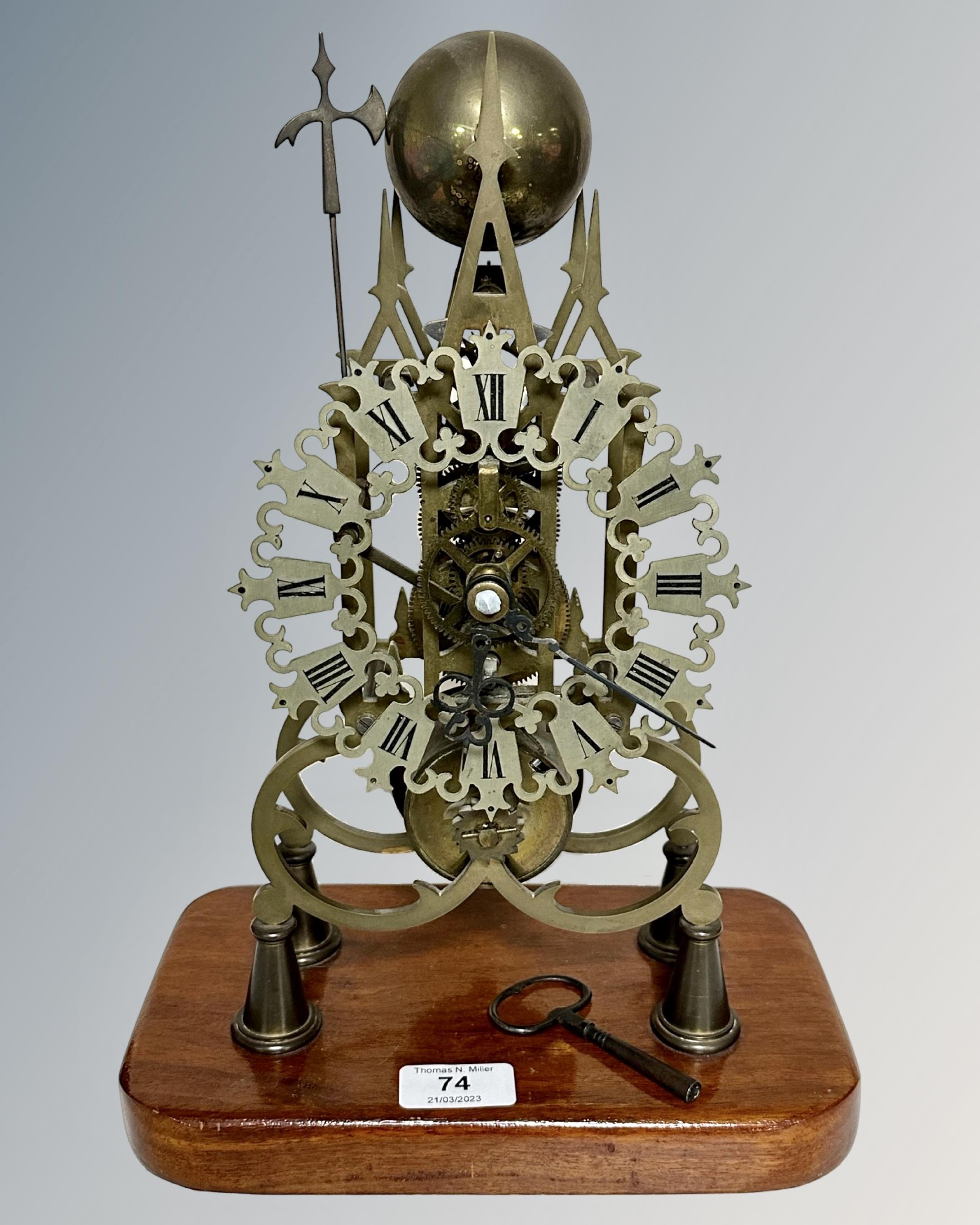 A Victorian style brass skeleton clock with single fusee movement, deadbeat escapement,