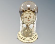 A 20th century German Kundo anniversary clock under glass shade