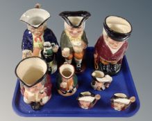 A tray of eight Toby jugs to include Royal Doulton The Huntsman, Happy John,