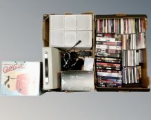 Two boxes of CD's, DVD's, cassette and VHS tapes, cased typewriter,