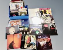 A box of vinyl records to include 12" and 7" singles, Madonna, Blondie, Duran Duran, The Cure,