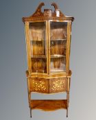 A Victorian mahogany marquetry inlaid bow fronted display cabinet on stand,