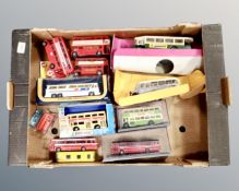 A box containing boxed and unboxed die cast busses.