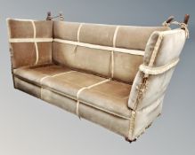 An early 20th century drop end sofa upholstered in a tasselled dralon fabric,