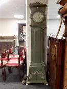 A continental painted longcase clock with circular dial and weights.