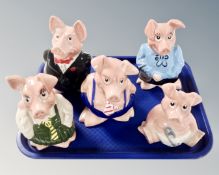 A tray containing five Wade NatWest pigs.