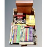 A box containing children's books including Horrible Histories box set, Rupert the Bear,