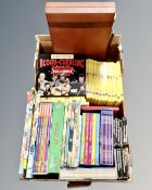 A box containing children's books including Horrible Histories box set, Rupert the Bear,