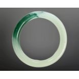 A carved jade circular bangle, inner diameter 58mm.