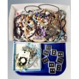 A tray containing a quantity of assorted costume jewellery together with eight pairs of Diamante
