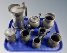 A tray containing antique pewter pieces including measuring jugs demi-litre tankard,