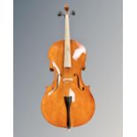 A student cello in soft carry bag,