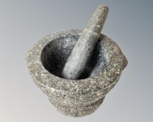 A granite pestle and mortar.