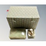 A Chinese fabric upholstered box containing an onyx cigarette case and lighter.
