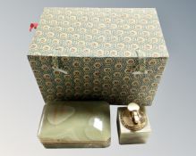 A Chinese fabric upholstered box containing an onyx cigarette case and lighter.