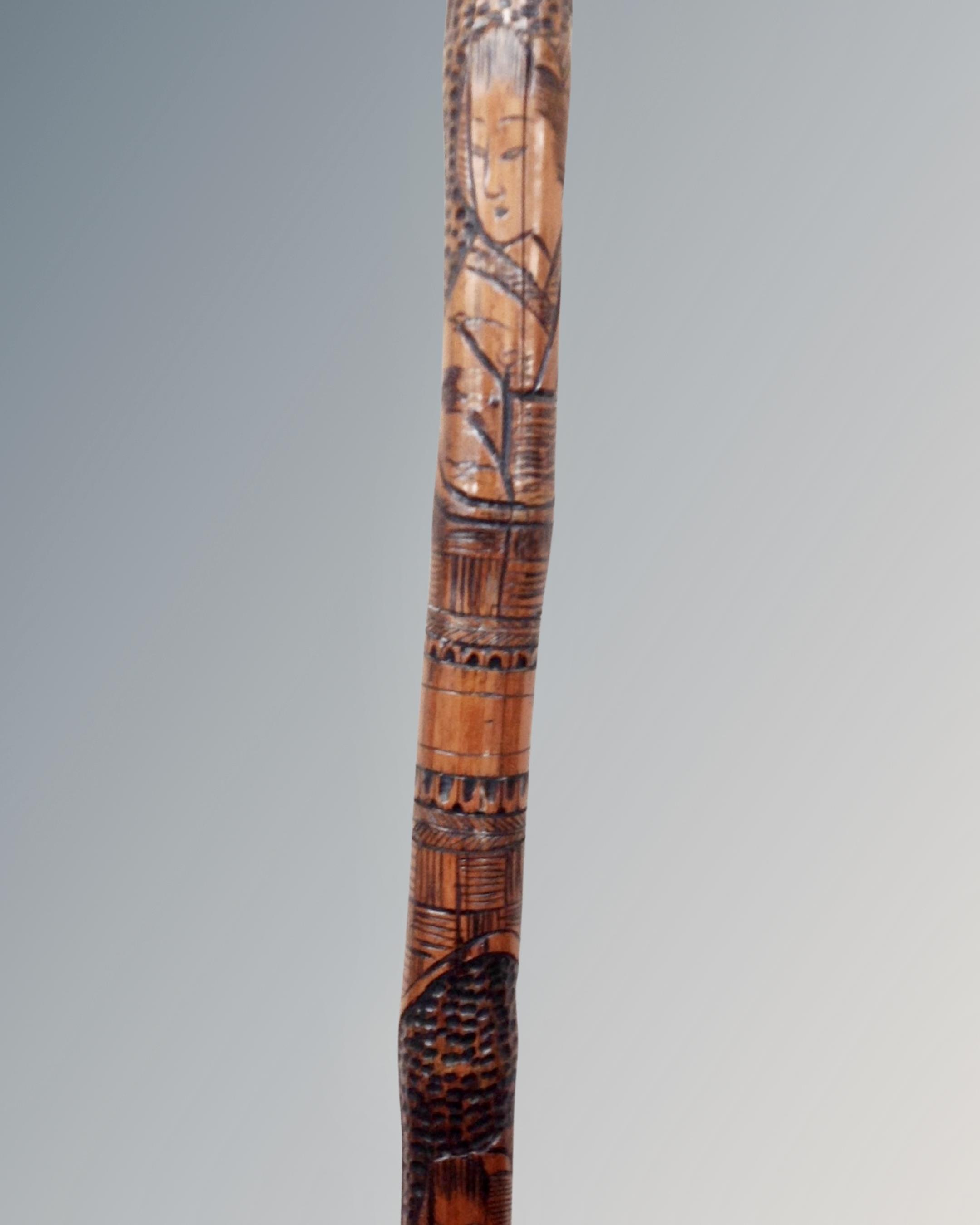 A vintage Oriental carved bamboo walking stick depicting geishas. - Image 2 of 2