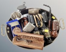 A twin handled tray containing vintage pipes, field glasses, stirrup cup, plated cigarette case etc.