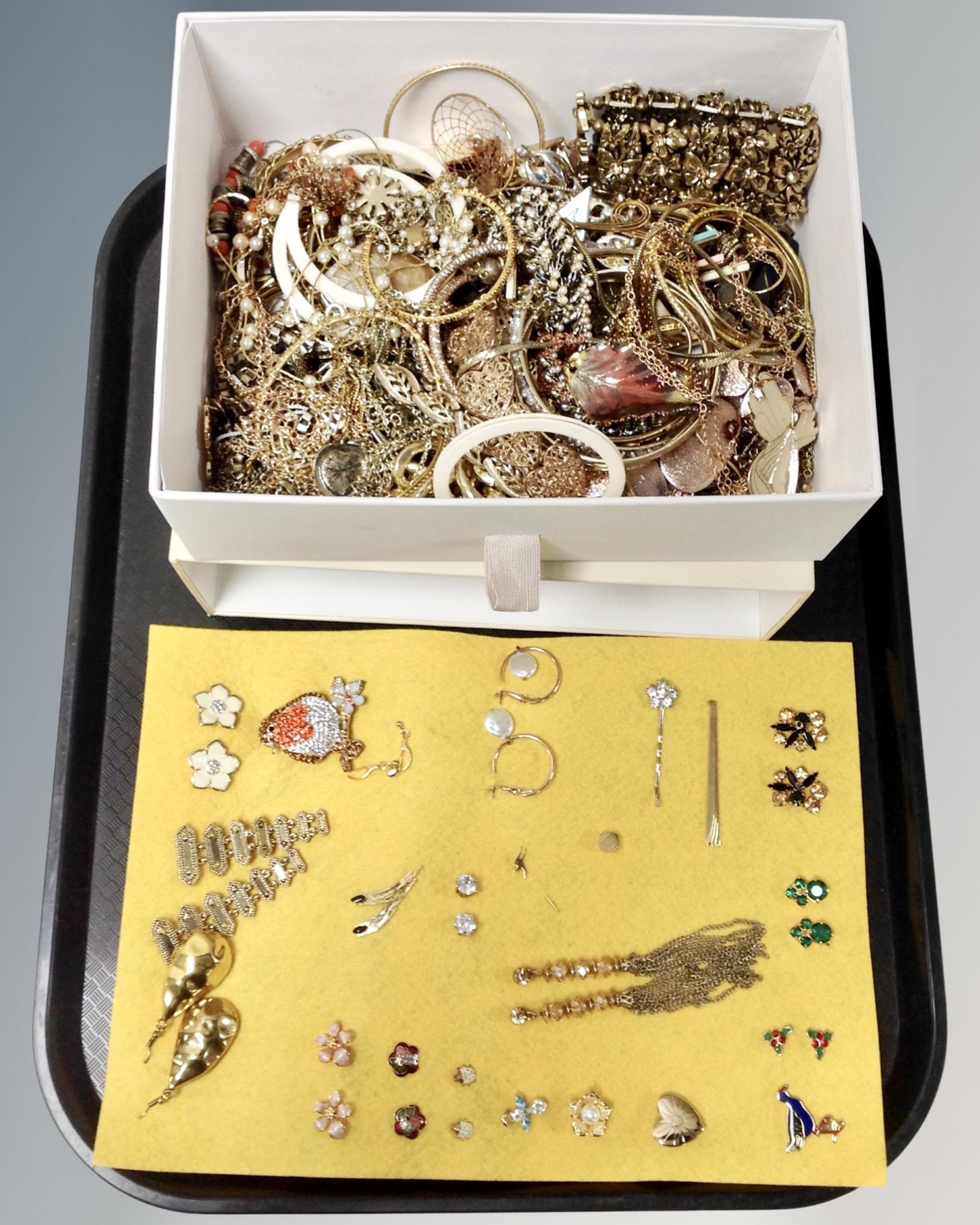 A jewellery drawer containing a large quantity of gilt finish costume jewellery together with a