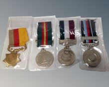 Four middle eastern medals on ribbons