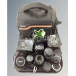 A tray containing Tecno camera bag together with a quantity of assorted camera lenses including