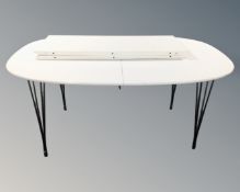 A late 20th century white extendable 'Superellipse' dining table after a design by Piet Hein and