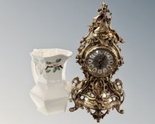 An ornate brass mantel clock with quartz movement and a Ringtons lustre jug.