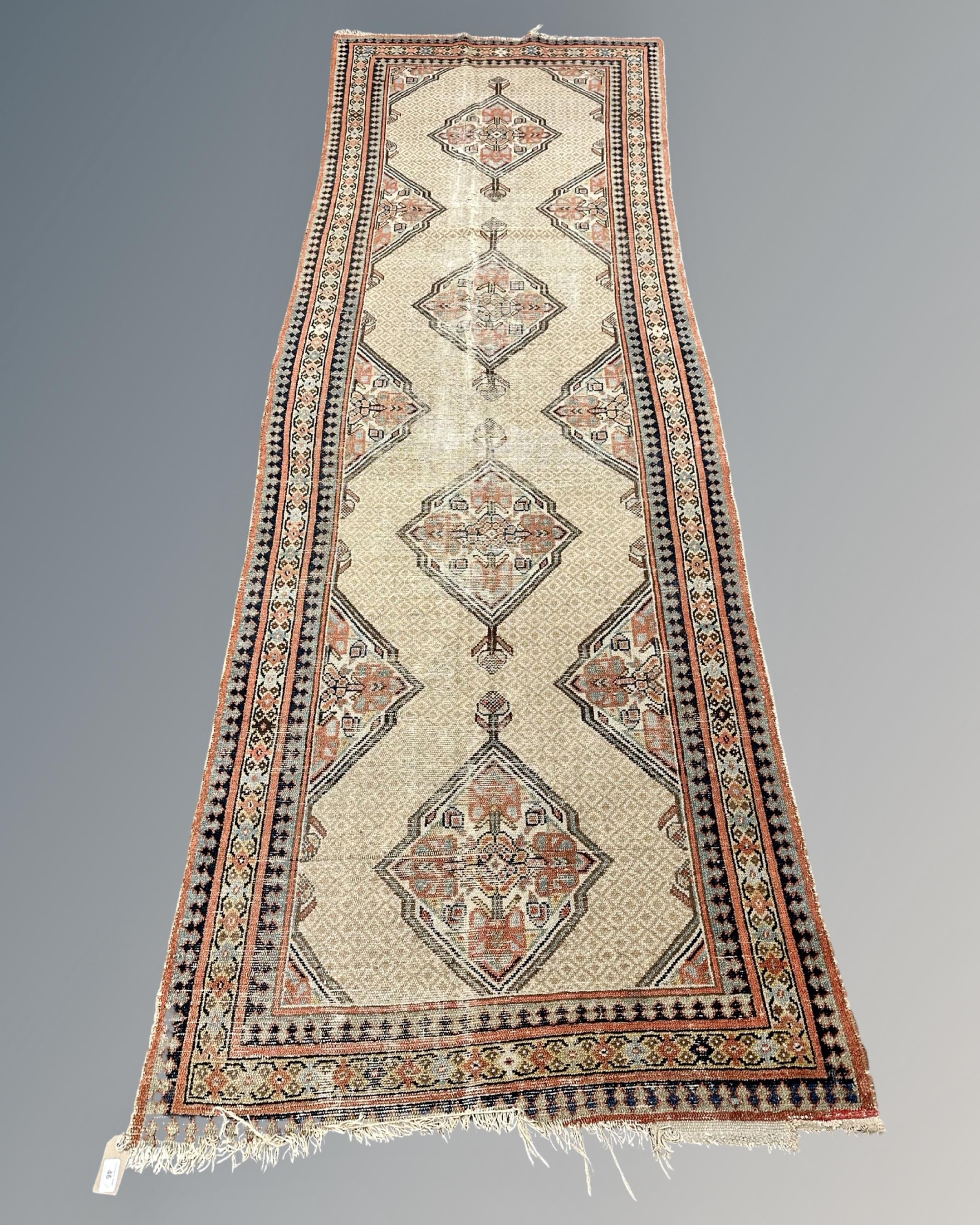 An antique Melas runner, West Anatolia, circa 1900, 305cm by 100cm.