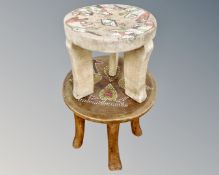 Two African stools with hand painted decoration.