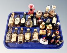 A tray containing a quantity of alcohol miniatures including whiskey.