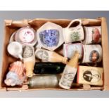 A box containing antique and later glass and later pottery bottles, skater figure,