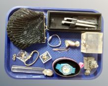 A tray containing an Art Deco style beaded purse, a pair of Cerruti pens, Newcastle United pens,
