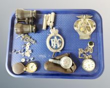 A tray containing a plated pocket watch with Albert chain, RAC and AA badge,