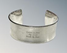A 925 silver wide, heavy concave design bangle with dedication.