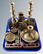 A tray containing assorted antique and later brass ware including candlesticks, vases, doorstop etc.