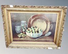 An early 20th century print of a still life with fruit, in gilt frame, 70cm by 49cm.