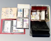 A box containing six albums and folders containing world stamps and first day covers,