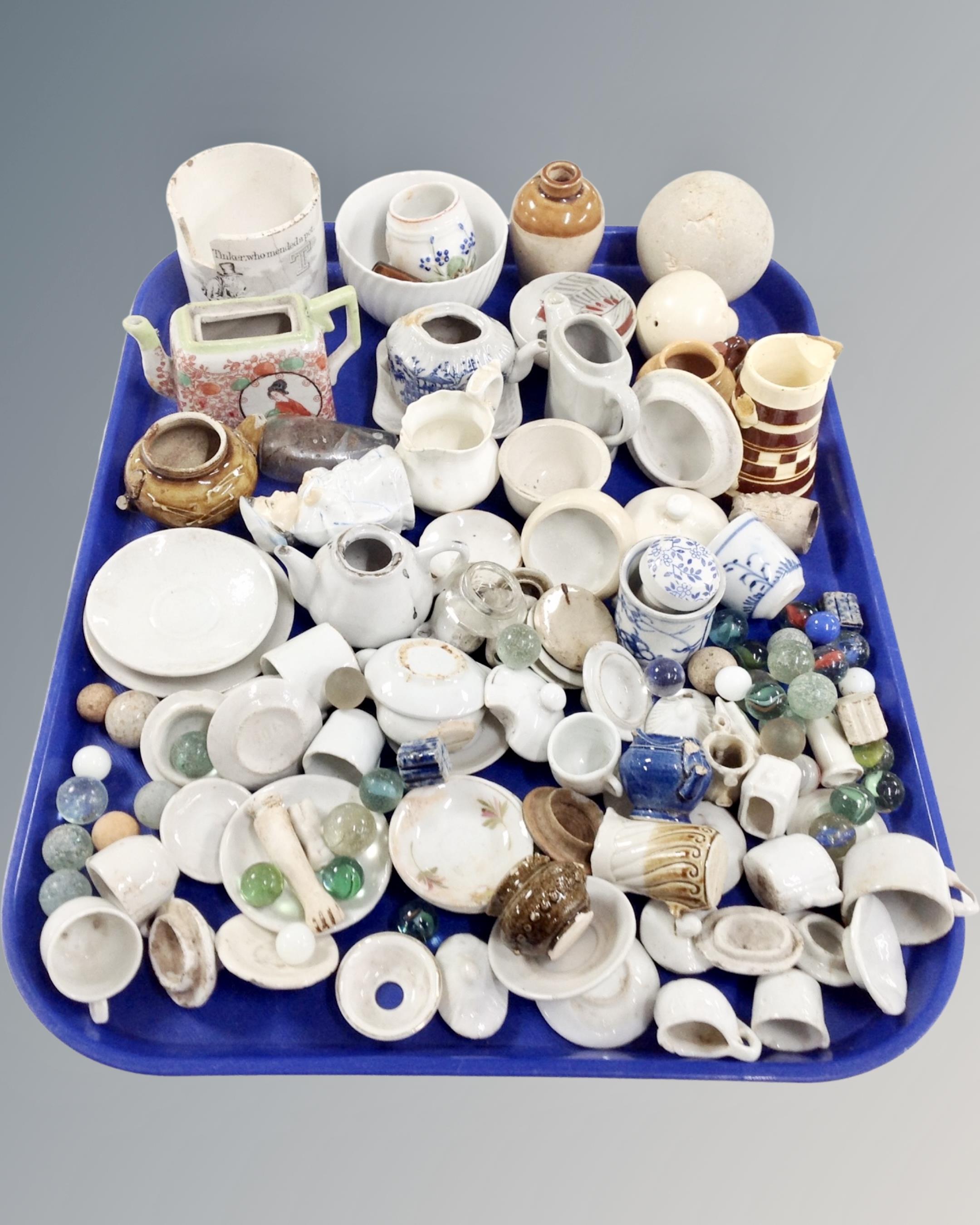 A tray containing a large quantity of antique ceramics (AF) and glass marbles.