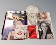 A tray containing a glass head, Monro perfume box, Marilyn Monroe calendar,