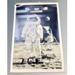 A vintage pull down poster, Apollo 11 astronauts Armstrong, Aldrin and Collins,