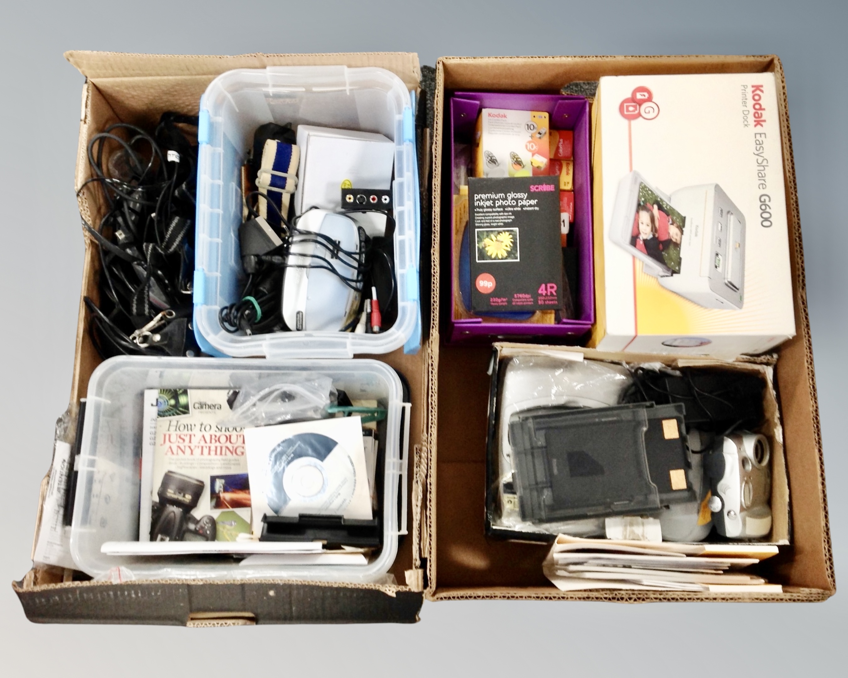 Two boxes containing Kodak easy share G600 photo printer, printer paper, cartridges,