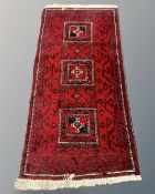 An Afghan long rug,