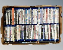 A box containing a large quantity of Blu-rays including Gremlins, Groundhog Day, Big, The Goonies,