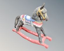 A miniature painted rocking horse.