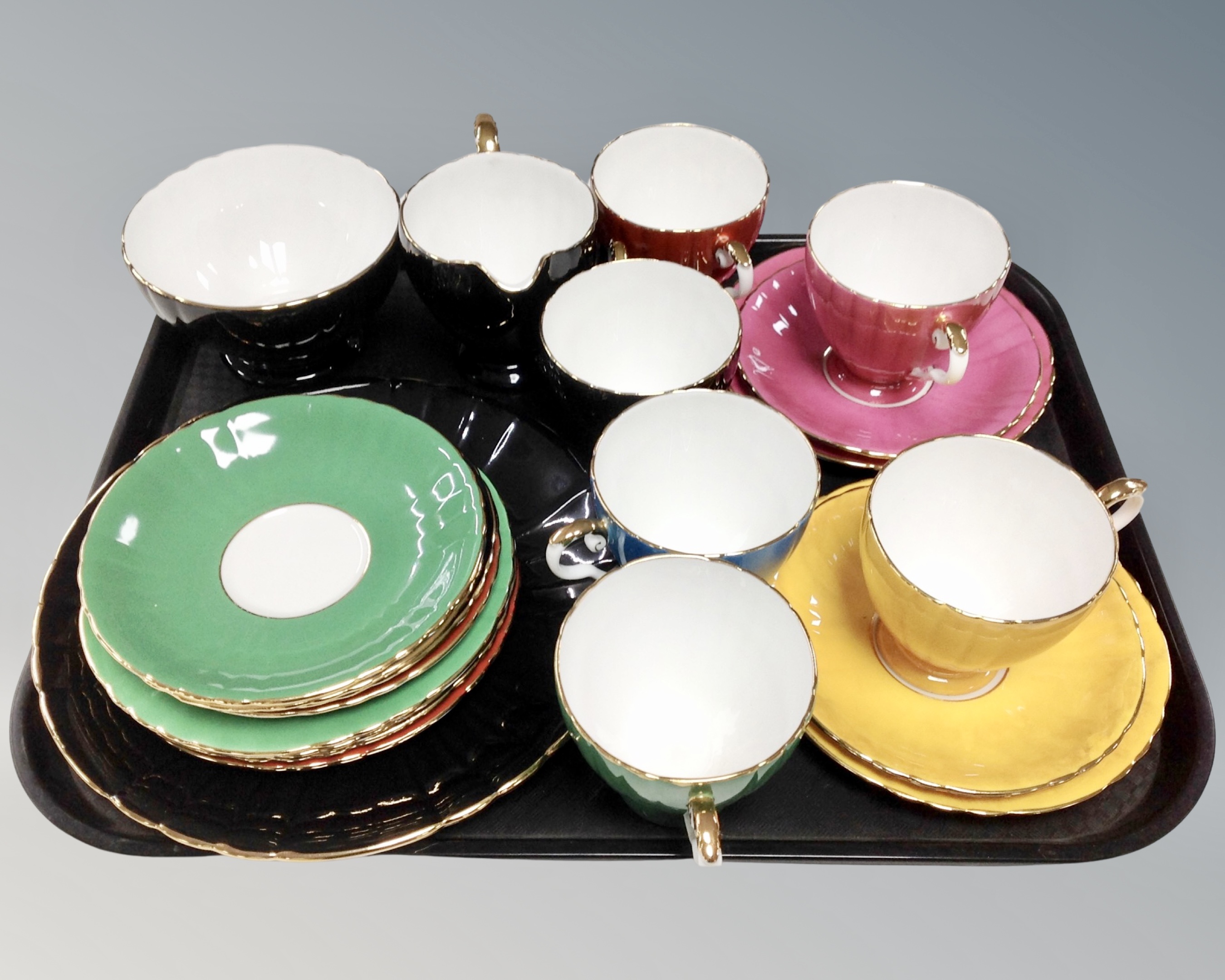 A 21 piece Royal Grafton harlequin bone china tea service.