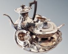 A four piece Sheffield plate tea service together with two circular plated trays,