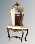 An ornate style gilt and marble topped console table with mirror,