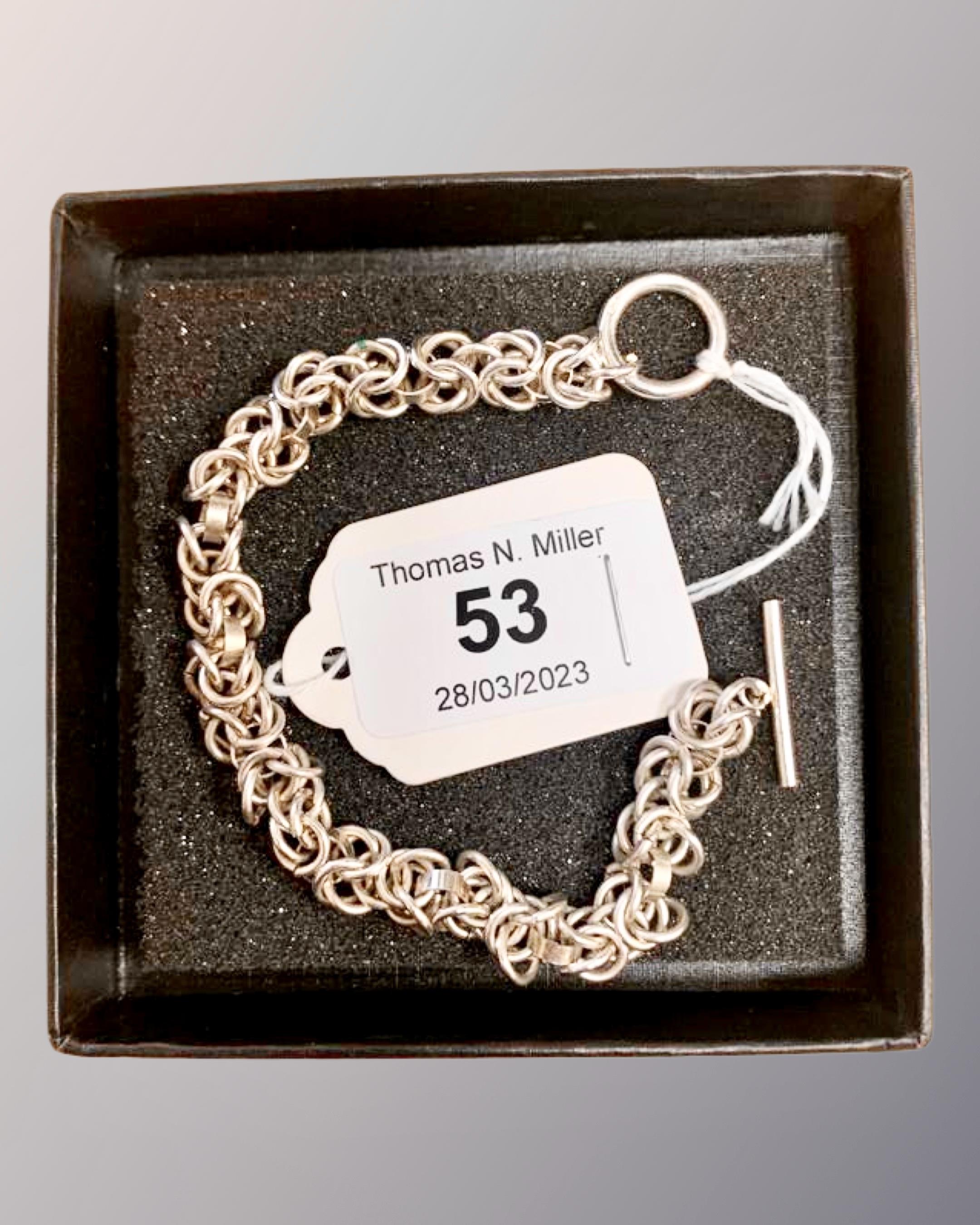 A 7.5" silver bracelet.