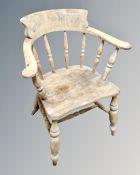 An antique captains armchair.